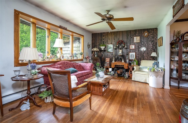 24 Briarbrook Rd, Ossining, NY 10562 - living room featuring baseboard heating, a ceiling fan, wood finished floors, and ornamental molding