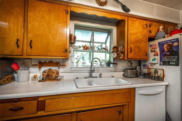 24 Briarbrook Rd, Ossining, NY 10562 - kitchen with a sink, light countertops, brown cabinets, and white appliances