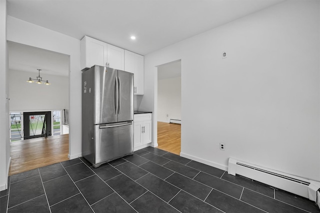 125 Lakewood Dr, Congers, NY 10920 - kitchen featuring freestanding refrigerator, baseboard heating, a chandelier, dark tile patterned flooring, and recessed lighting