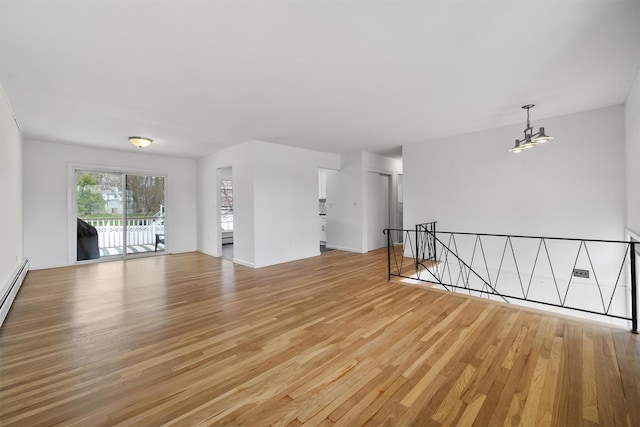125 Lakewood Dr, Congers, NY 10920 - spare room featuring light wood finished floors and a chandelier