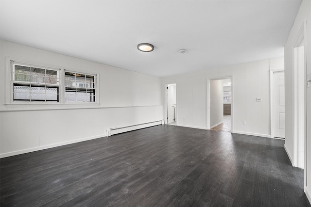 125 Lakewood Dr, Congers, NY 10920 - empty room featuring a baseboard heating unit and dark wood-style floors