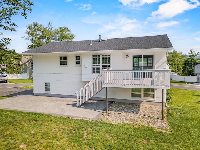 125 Lakewood Dr, Congers, NY 10920 - rear view of property featuring a yard, roof with shingles, a patio, and stairs