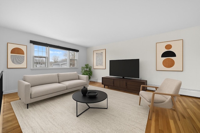 125 Lakewood Dr, Congers, NY 10920 - living room featuring wood finished floors and a baseboard radiator