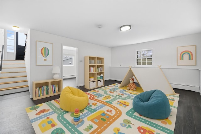125 Lakewood Dr, Congers, NY 10920 - rec room with a baseboard radiator, healthy amount of natural light, and wood finished floors