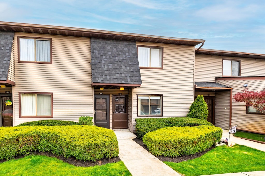 100 Daly Blvd Unit 411, Oceanside, NY 11572 - townhome / multi-family property featuring a shingled roof