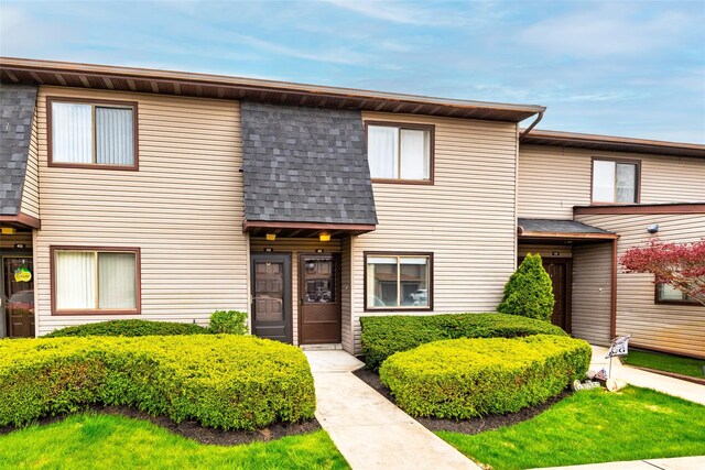 100 Daly Blvd Unit 411, Oceanside, NY 11572 - townhome / multi-family property featuring a shingled roof