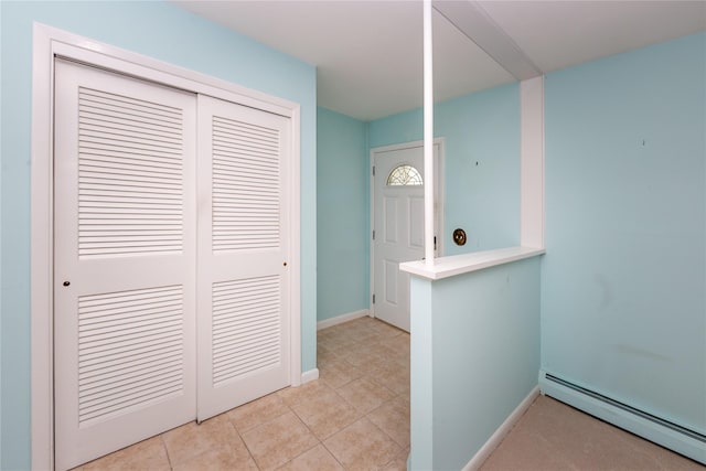 37 Lincoln Dr, Poughkeepsie, NY 12601 - foyer featuring a baseboard heating unit, baseboards, and light tile patterned floors