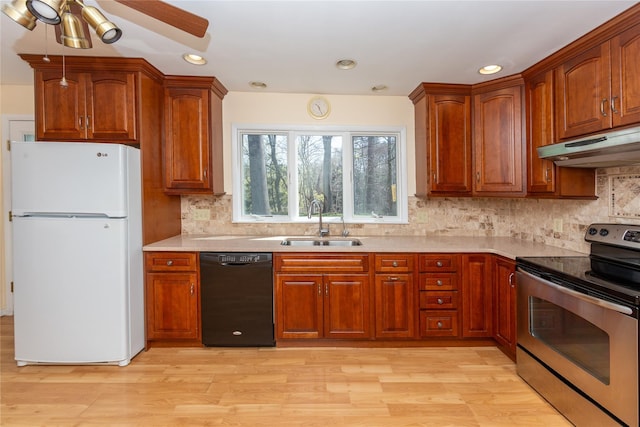 37 Lincoln Dr, Poughkeepsie, NY 12601 - kitchen with a sink, freestanding refrigerator, black dishwasher, under cabinet range hood, and electric stove