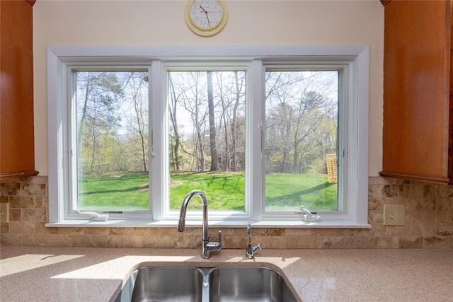 37 Lincoln Dr, Poughkeepsie, NY 12601 - details featuring backsplash, light stone countertops, and a sink