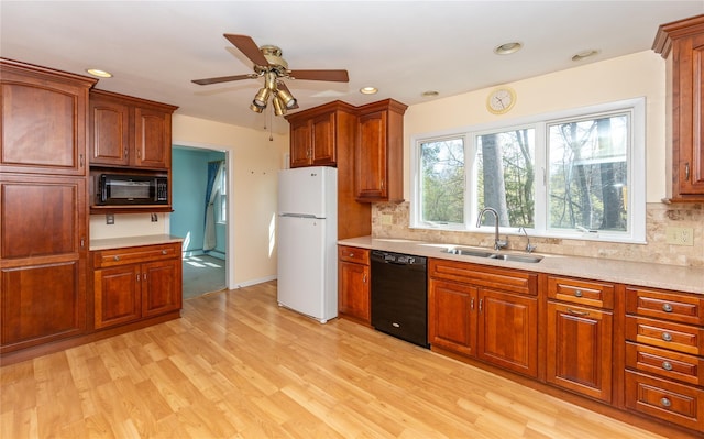 37 Lincoln Dr, Poughkeepsie, NY 12601 - kitchen featuring black appliances, backsplash, a sink, and light countertops