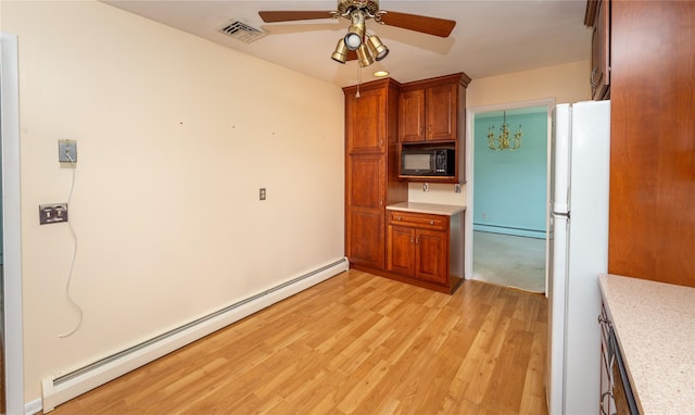 37 Lincoln Dr, Poughkeepsie, NY 12601 - kitchen featuring a baseboard radiator, a ceiling fan, black microwave, visible vents, and freestanding refrigerator