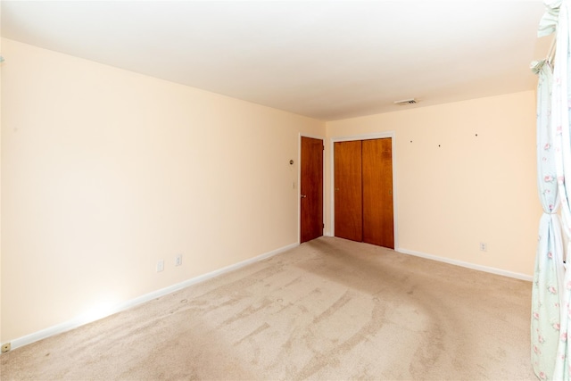 37 Lincoln Dr, Poughkeepsie, NY 12601 - spare room featuring light colored carpet, baseboards, and visible vents