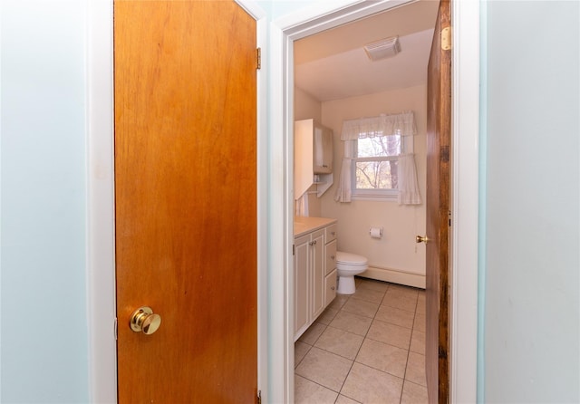 37 Lincoln Dr, Poughkeepsie, NY 12601 - bathroom featuring baseboard heating, tile patterned floors, vanity, toilet, and visible vents