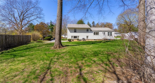 37 Lincoln Dr, Poughkeepsie, NY 12601 - rear view of house with fence and a yard