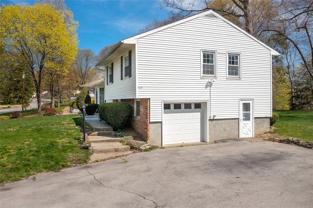 37 Lincoln Dr, Poughkeepsie, NY 12601 - view of home's exterior featuring driveway, a yard, and a garage