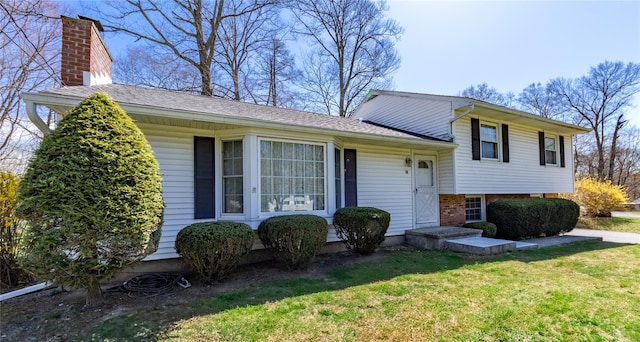 37 Lincoln Dr, Poughkeepsie, NY 12601 - tri-level home with a front lawn and brick siding