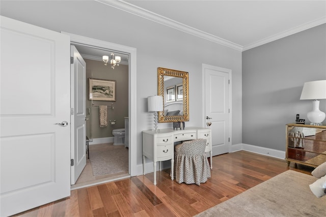 bedroom with crown molding, baseboards, wood finished floors, and a chandelier