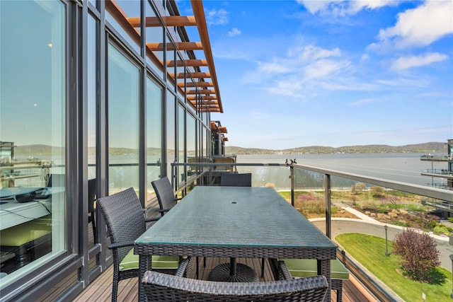 balcony featuring a water view
