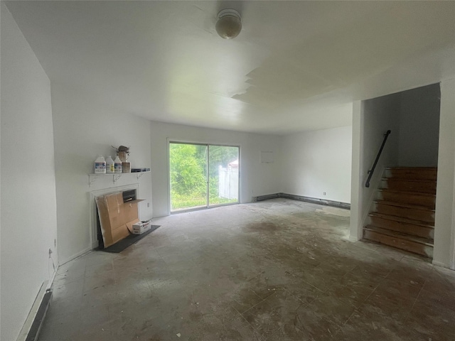 8 Brookside Dr W, Harriman, NY 10926 - unfurnished living room featuring a fireplace and stairway