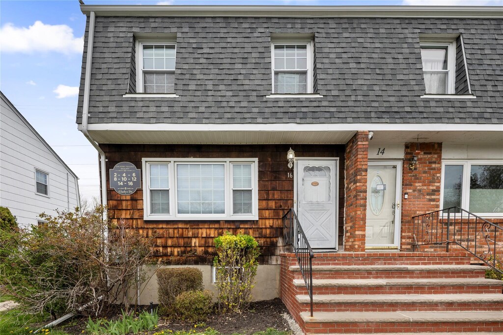 16 Gladys Dr, Spring Valley, NY 10977 - view of front of home with mansard roof and a shingled roof