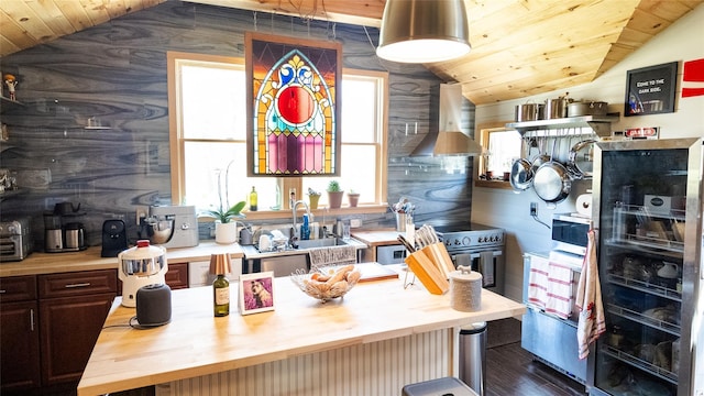 kitchen with wall chimney range hood, wood counters, lofted ceiling, and wood ceiling