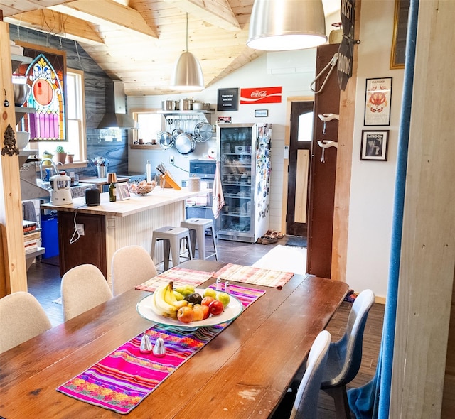 dining room with lofted ceiling and wood ceiling