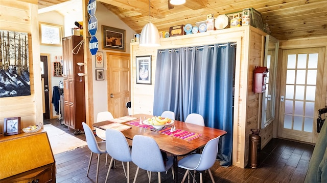 dining area featuring dark wood-type flooring, vaulted ceiling, and wooden ceiling