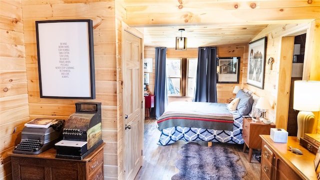 bedroom with wooden ceiling, wood finished floors, and wood walls