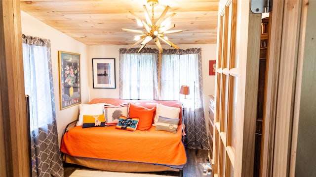 bedroom with wood finished floors, wooden ceiling, ceiling fan, and multiple windows