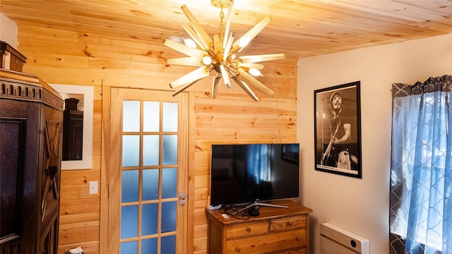 bedroom featuring wooden walls and wood ceiling