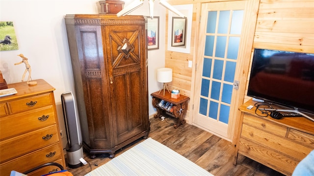 bedroom with wood finished floors