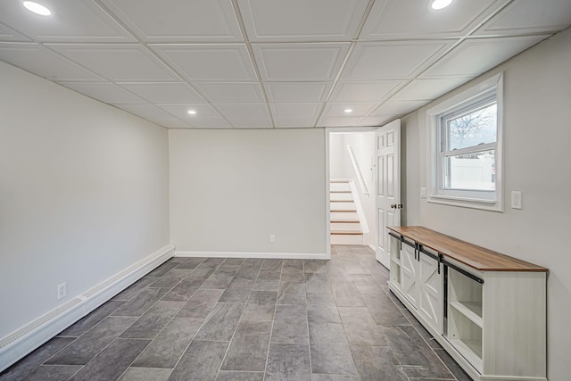interior space with recessed lighting, baseboards, and stairs