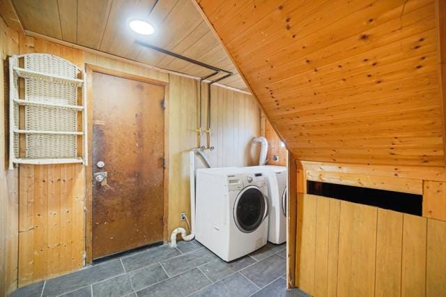 washroom with wood ceiling, wood walls, washer / clothes dryer, and laundry area