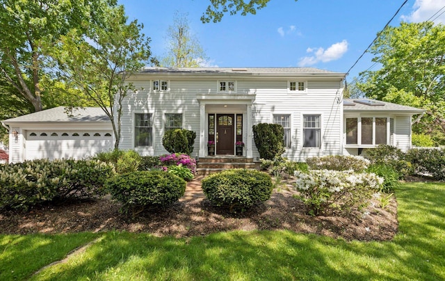 8 Prospect Rd, Centerport, NY 11721 - view of front of property with a garage and a front yard