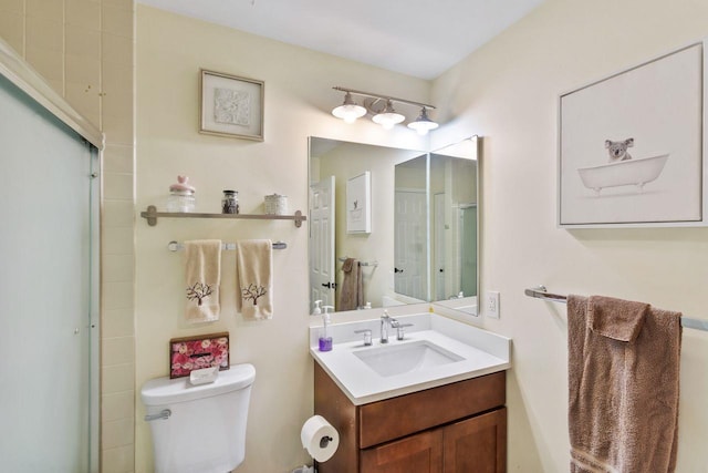 full bath featuring an enclosed shower, toilet, and vanity