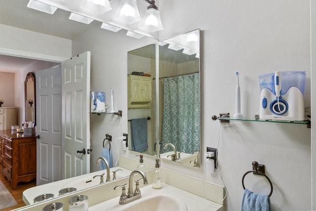 bathroom with a shower with curtain and vanity