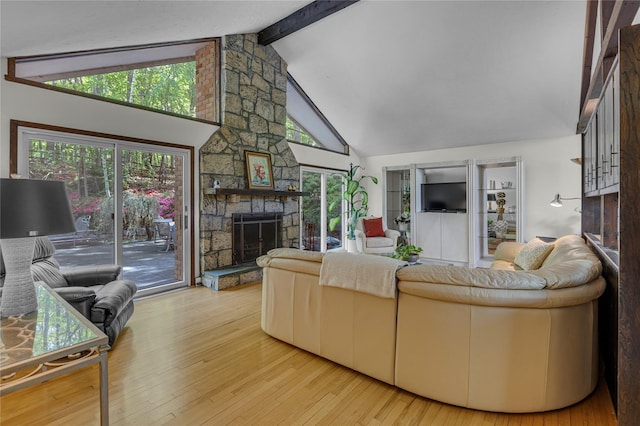 9 Salonga Woods Rd, Northport, NY 11768 - living area featuring a stone fireplace and wood finished floors