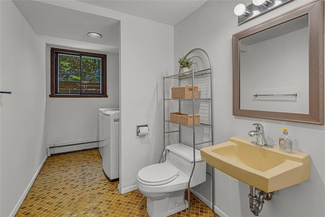 9 Salonga Woods Rd, Northport, NY 11768 - bathroom featuring baseboard heating, washer and dryer, baseboards, and toilet