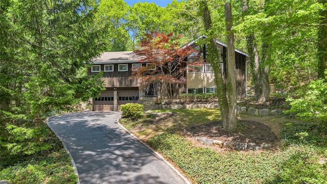 9 Salonga Woods Rd, Northport, NY 11768 - view of front of property featuring asphalt driveway and an attached garage