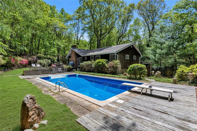 9 Salonga Woods Rd, Northport, NY 11768 - swimming pool with a lawn, a deck, and a diving board