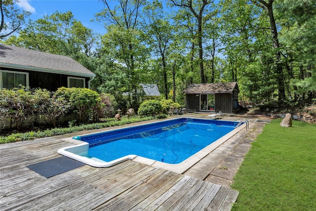 9 Salonga Woods Rd, Northport, NY 11768 - swimming pool featuring a wooden deck, an outbuilding, and a lawn