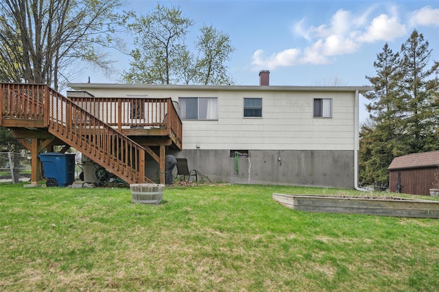 back of property with a chimney, stairway, a yard, and a deck