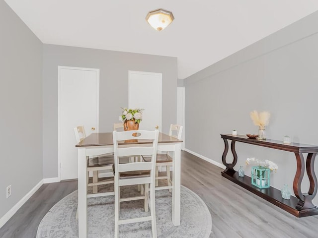 270 N Broadway Unit 6H, Yonkers, NY 10701 - dining space featuring wood finished floors and baseboards