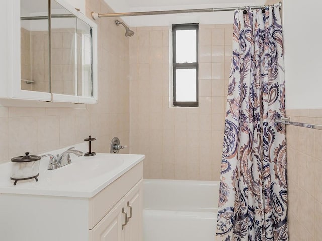 270 N Broadway Unit 6H, Yonkers, NY 10701 - full bath with tile walls, shower / bath combo with shower curtain, and vanity
