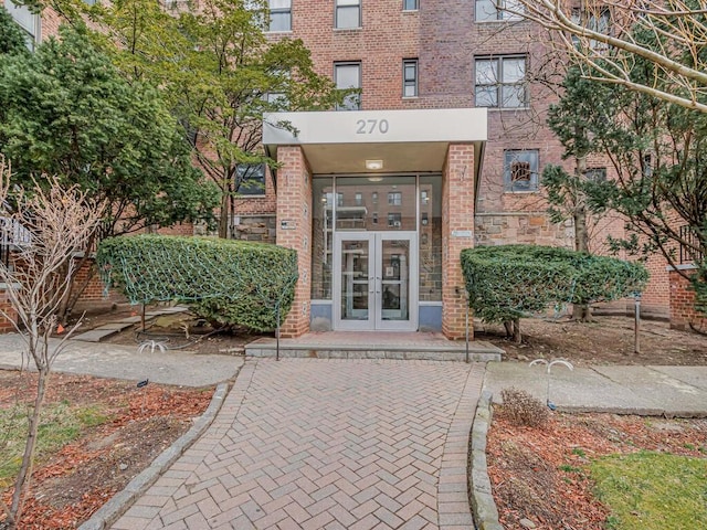 270 N Broadway Unit 6H, Yonkers, NY 10701 - view of exterior entry featuring brick siding and french doors