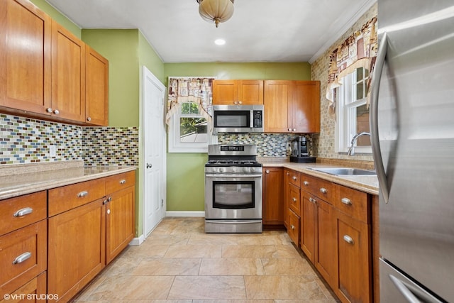66 Vernon Ave, Mount Vernon, NY 10553 - kitchen with appliances with stainless steel finishes, a sink, healthy amount of natural light, and brown cabinetry
