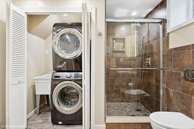 66 Vernon Ave, Mount Vernon, NY 10553 - bathroom featuring estacked washer and dryer, a shower stall, toilet, recessed lighting, and vanity