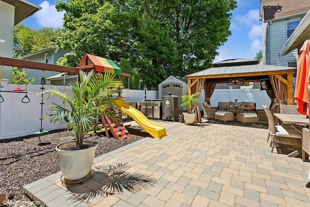 66 Vernon Ave, Mount Vernon, NY 10553 - fenced backyard with outdoor lounge area, a patio area, a gazebo, a playground, and a shed