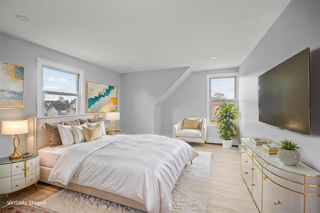 bedroom featuring recessed lighting and light wood finished floors