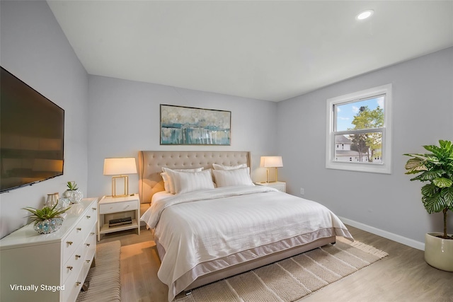 bedroom featuring recessed lighting, baseboards, and light wood-type flooring